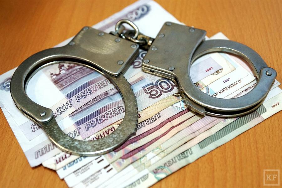 Handcuffs and money. Banknotes, rubles.