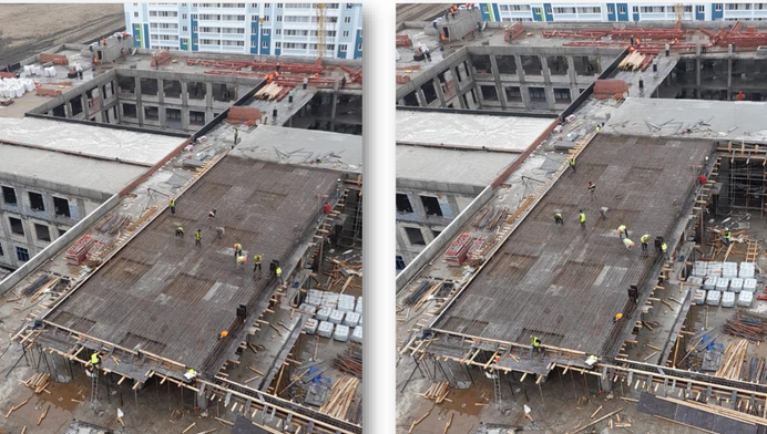 Рабочие заняты устройством стен и колонн третьего этажа